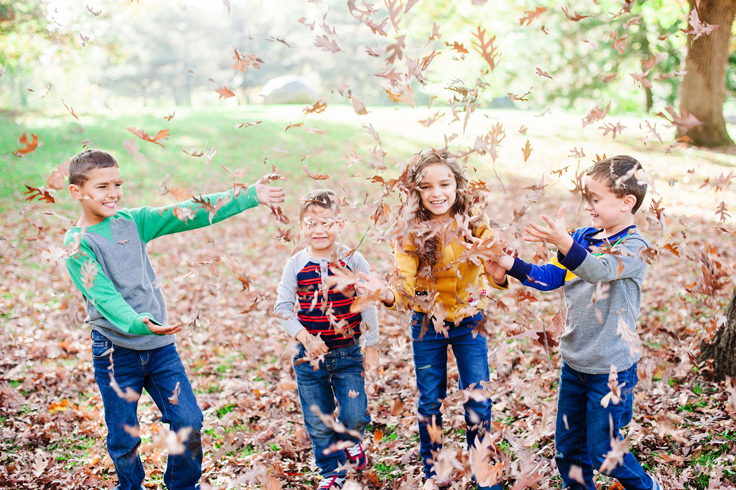 Kids playing in the leaves
