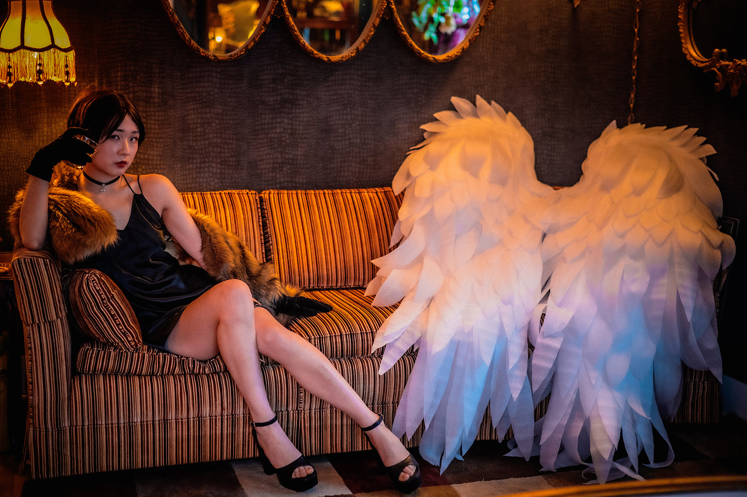 Asian girl on couch with wings