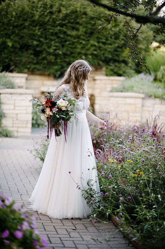 bride at The Minnesota Landscape Arboretum with bouquet