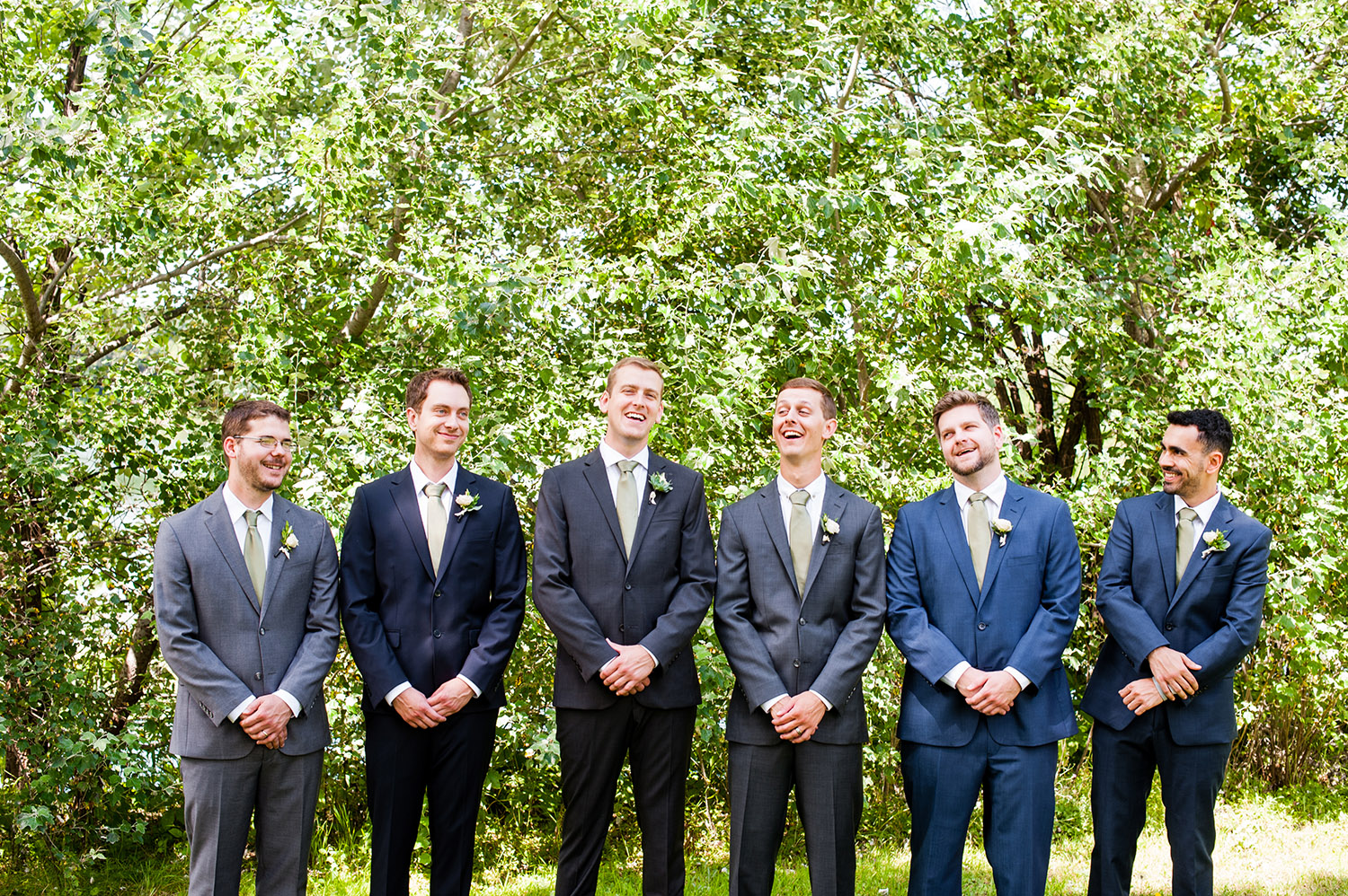 groom with groomsmen laughing