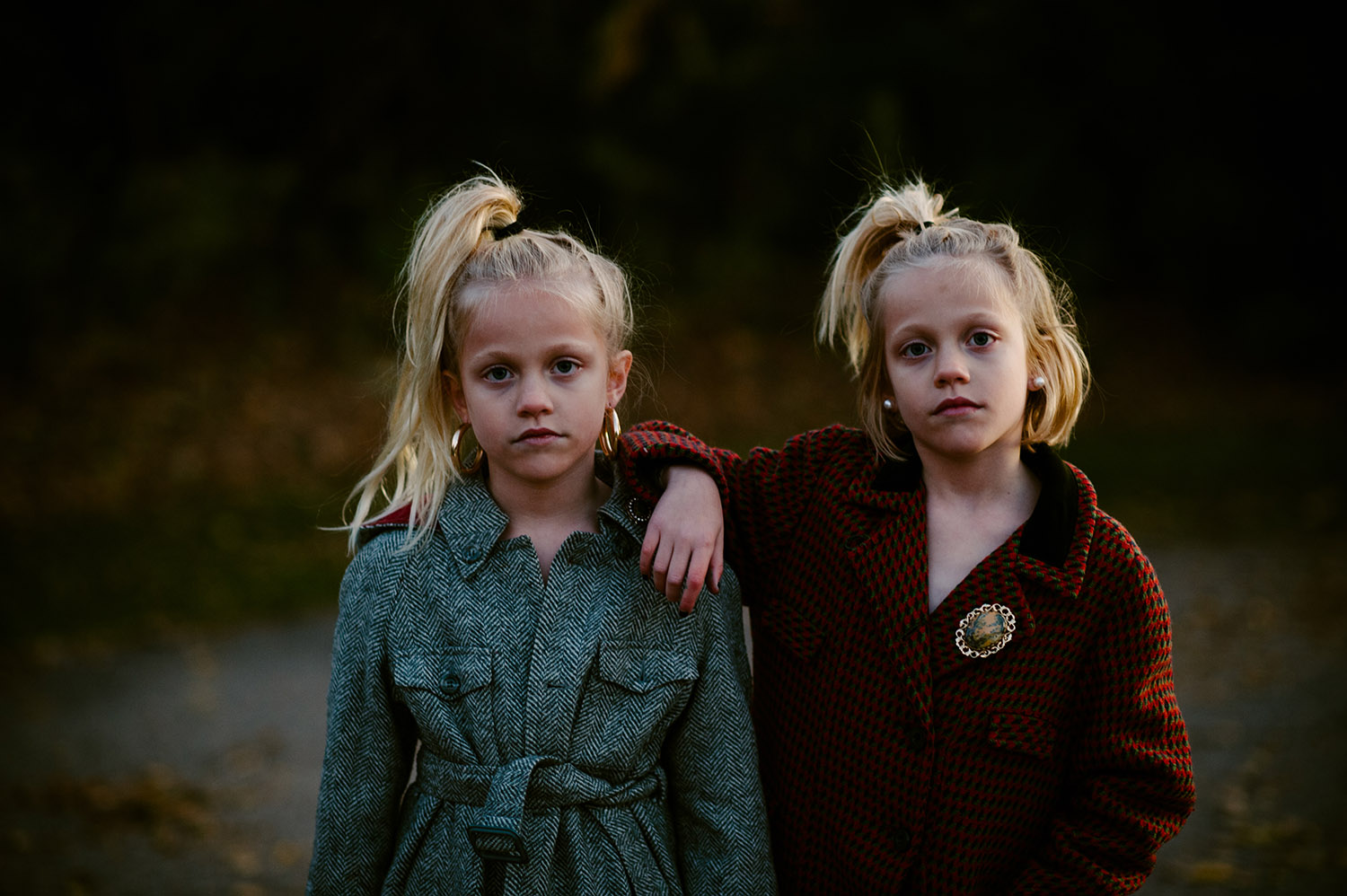 twin girls in vintage winter coats
